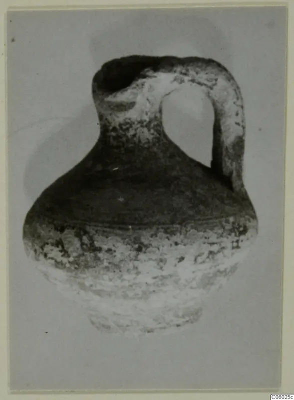 Pottery Black Slip I-VI: round-bodied jug with a strap handle