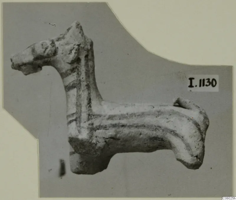 Terracotta animal figurine with an upright head, long neck and dark painted bands, seen in side view