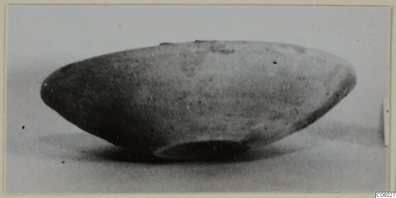 Side view of a Pottery Coarse Ware bowl with a rounded body and small ring base