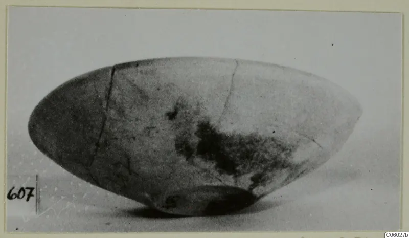 Pottery Plain White bowl, side view, with cracks and dark staining on its surface