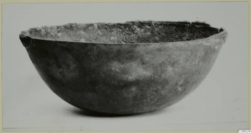 Deep rounded bowl with a rough, uneven rim, seen from the side against a plain background, Idalion
