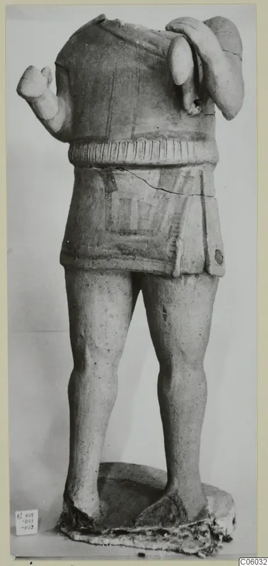 Headless terracotta figure with raised arms and a painted short garment, from Ayia Irini