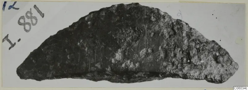Corroded bronze fragment, curved and tapering to a point, from Idalion