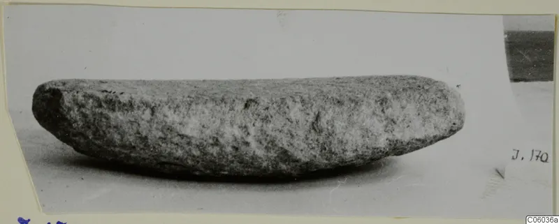 Stone grinder seen from the side, a find from Idalion, shown on a pale surface
