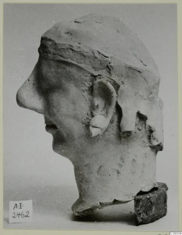 Terracotta head in profile facing left, from Ayia Irini, broken at the back of the head and at the neck