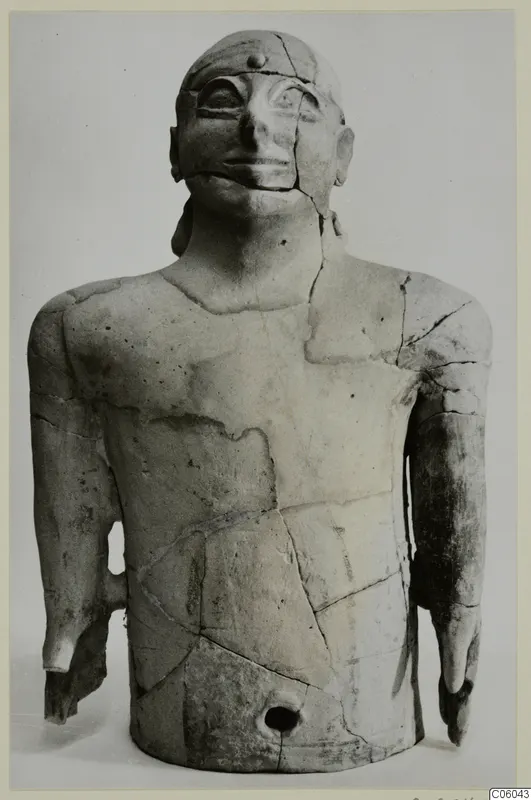Terracotta figure from Ayia Irini: upper body with arms and head, reassembled from cracked fragments