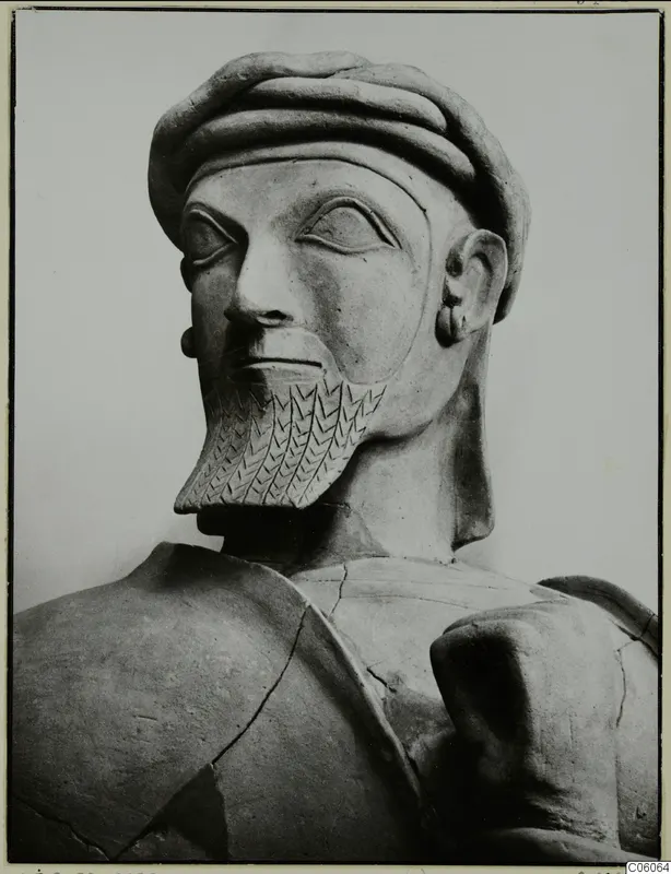 Terracotta statue of a bearded man with a ridged head covering and incised beard, from Ayia Irini