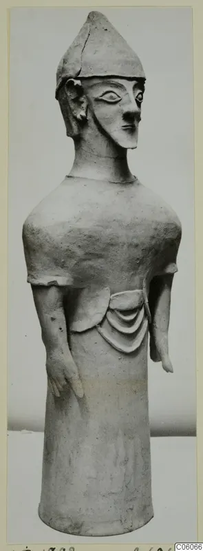 Terracotta figurine of a standing figure with a conical cap and arms at its sides, from Ayia Irini