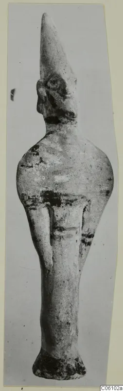 Terracotta statuette from Ayia Irini, a standing figure with a tall pointed headdress and a flared base