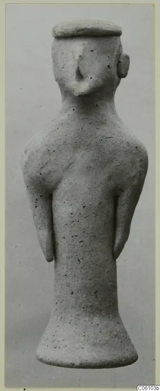 Terracotta figurine of a standing human figure with arms at its sides, front view, from Ayia Irini