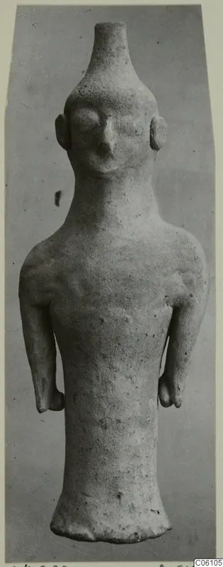 Terracotta figurine of a standing figure from Ayia Irini, with a tall neck, stubby arms and a flared base