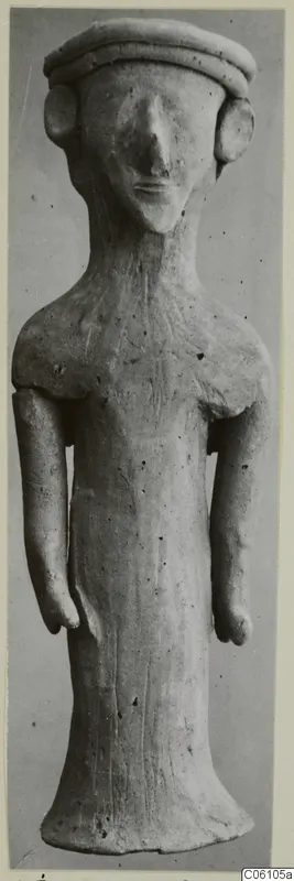 Terracotta statuette of a standing figure with a flat cap and disc-shaped ears, from Ayia Irini