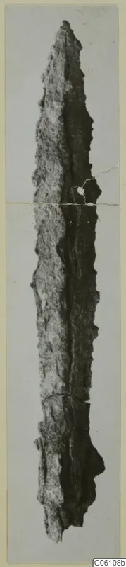 Corroded iron weapon, long and narrow, from the Amathus tombs series