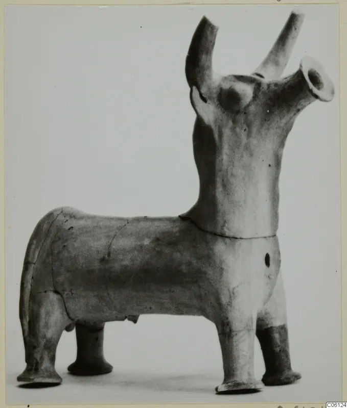 Terracotta figurine of a four-legged animal with tubular projections rising from its head