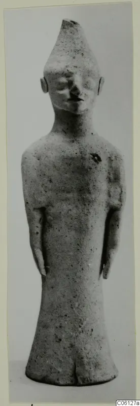 Terracotta figurine of a standing figure with a tall conical head and arms held at its sides
