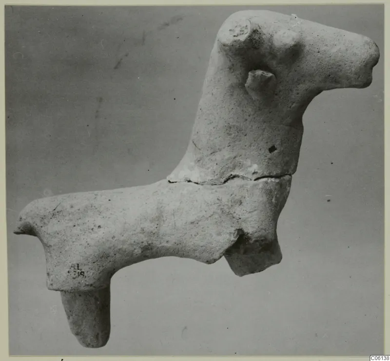 Terracotta figurine of an animal with a long neck and one leg hanging down, from Ayia Irini