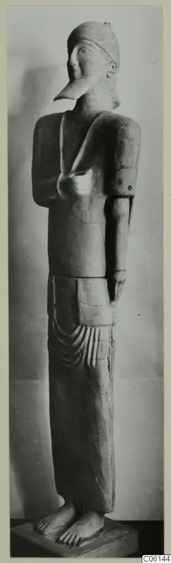 Neo-Cypriote terracotta statue of a standing figure with a long beaked nose and a close-fitting cap