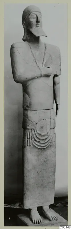 Standing Neo-Cypriote terracotta figure with arms folded across the chest