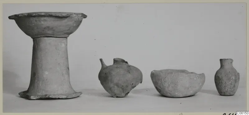 Four pottery vessels from Ayia Irini: a footed bowl, a round-bodied jug, a low bowl and a small narrow-necked jug.