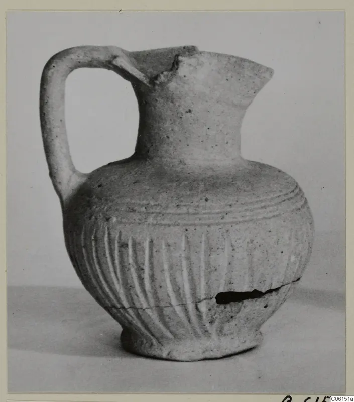 Ayia Irini pottery of Period 2: small jug with a loop handle and vertically grooved body