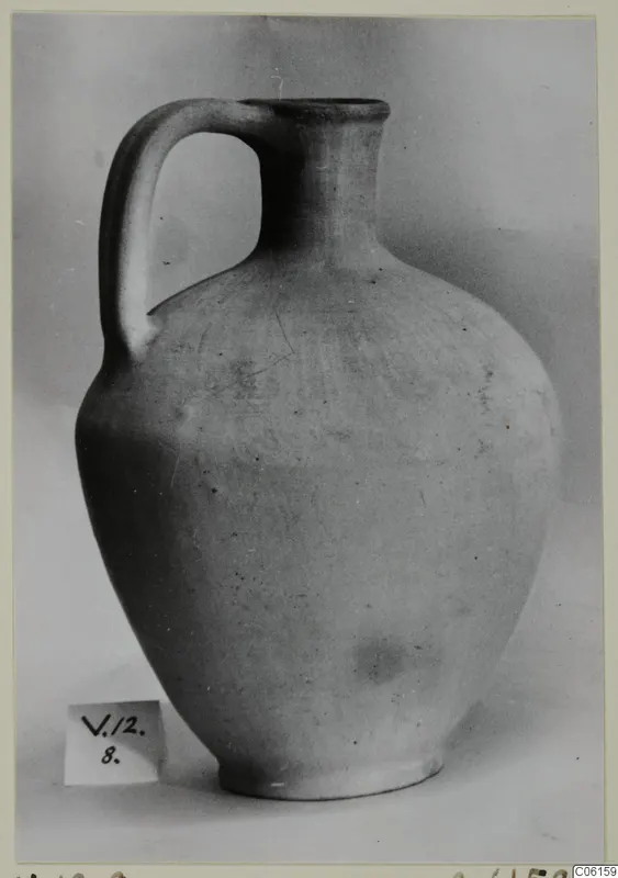 Pottery Plain White VI jug with a single loop handle and wide body, photographed against a grey backdrop.