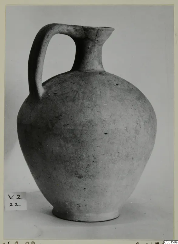 Pottery Plain White VI jug from Vouni, with a single strap handle and a narrow neck