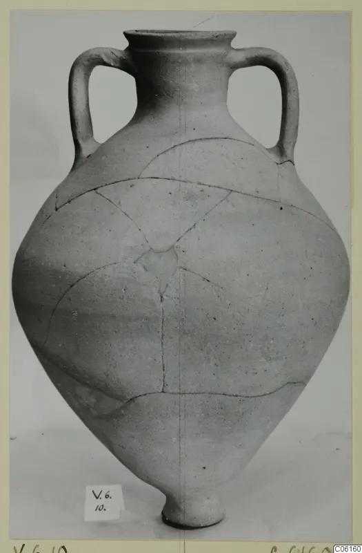 Pottery Plain White VII amphora with two handles, a pointed base and mended cracks across the body
