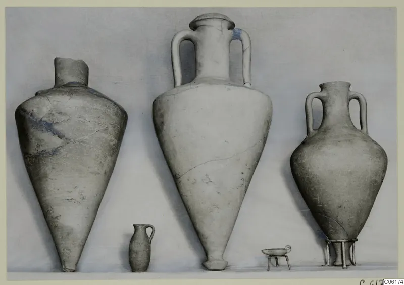Pottery vessels from Vouni Tomb 9: two two-handled amphoras, a tall jar, a small jug and a small bowl on legs