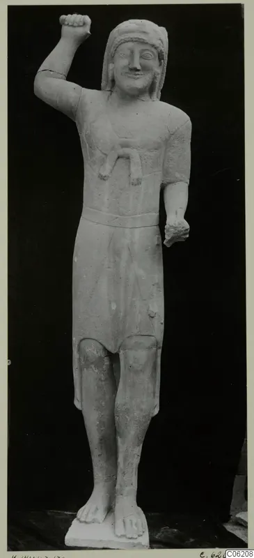 Limestone statue of a standing figure from Kition, one fist raised beside the head