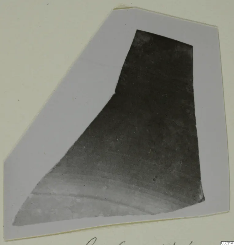 Pottery sherd photographed on a grey card mount, with handwritten caption along the bottom edge