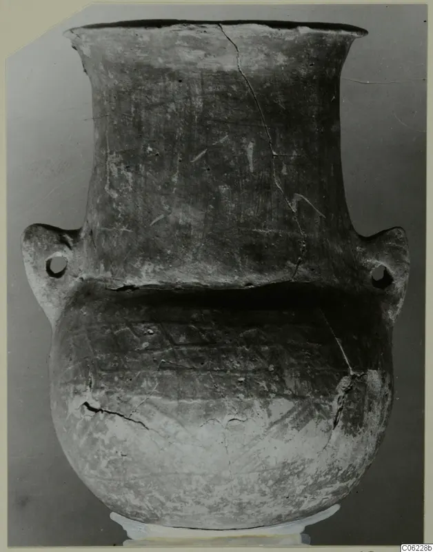 Pottery Red Polished III amphora with a flared neck, two lug handles and incised band decoration on the body