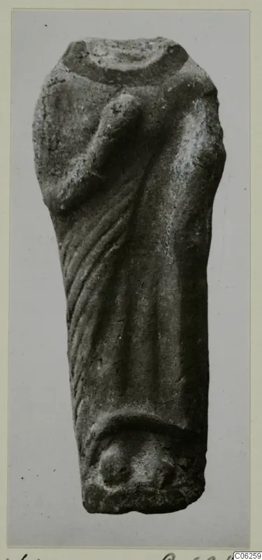 Terracotta figurine fragment of a draped standing figure, with vertical folds of cloth and a raised arm