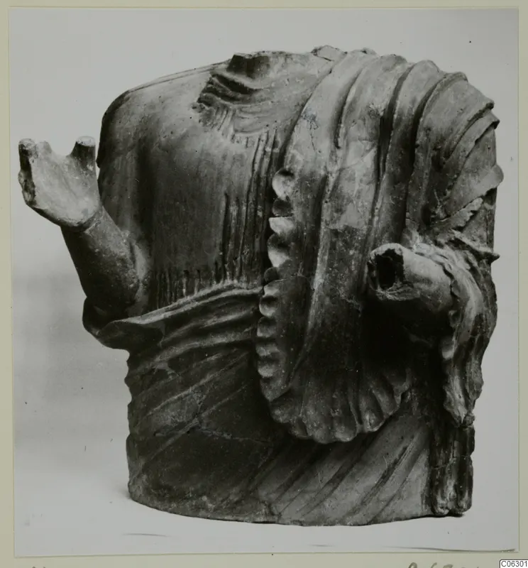 Terracotta figure fragment showing an upper body with stumps of two arms, from Mersinaki