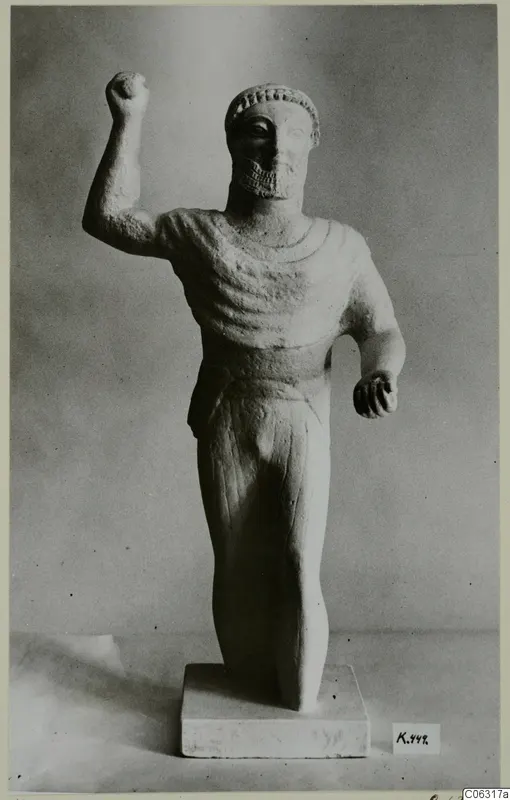 Limestone statue of a bearded male figure with one fist raised, from Kition