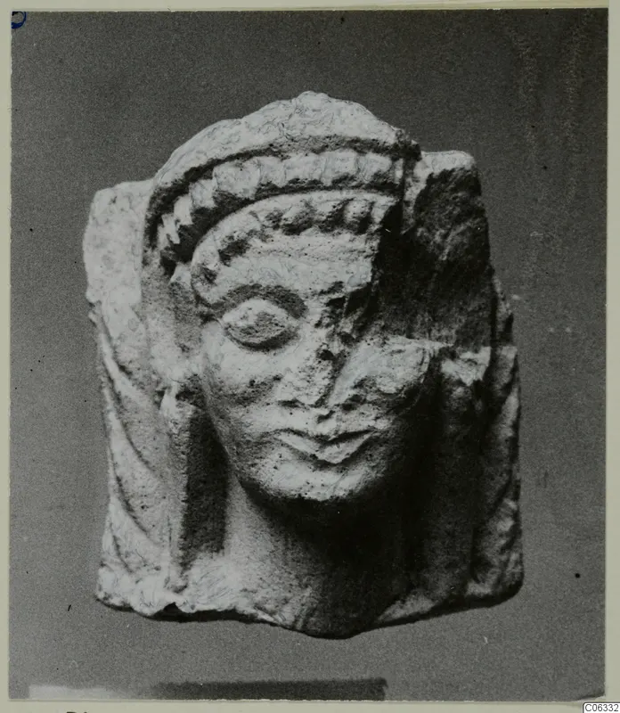Limestone statuette head with a banded headdress, from Vouni