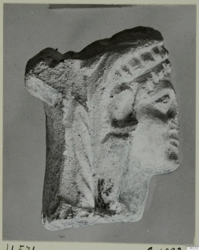 Limestone statuette fragment from Vouni showing a head in profile facing right, with a band across the hair