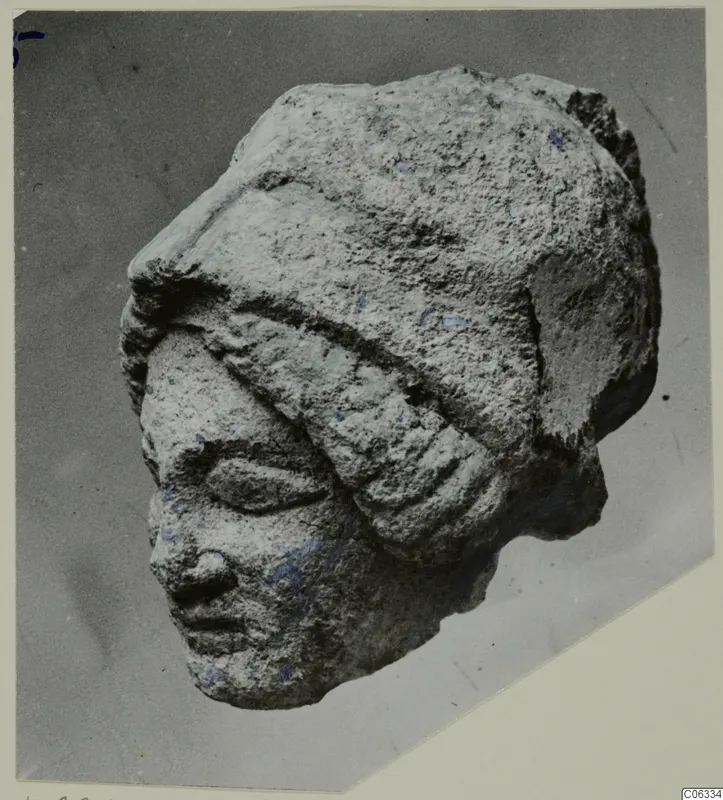 Limestone head from Vouni with a close-fitting headband, almond-shaped eyes, straight nose and small mouth