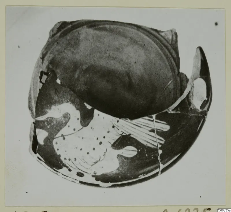Pottery sherd from Vouni, red figured ware, with dark glossy surface and pale painted pattern of dots and lines.