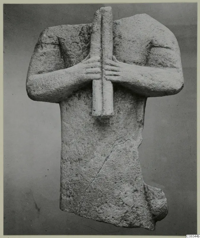 Limestone figure fragment from Kition, arms crossed over the chest and hands gripping a vertical bar
