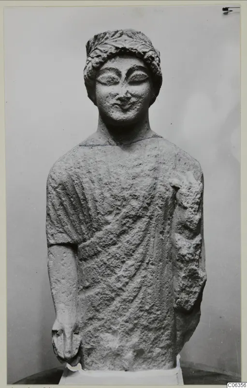 Limestone statue of a standing figure with a wreath around the head, from Kition