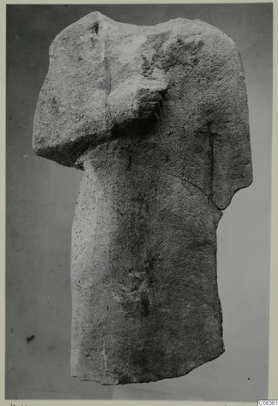 Limestone statue fragment of a headless torso, from Kition, with one arm bent across the chest