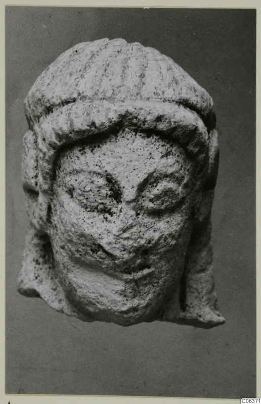 Limestone head from Vouni, front view, with a ridged headdress and large eyes