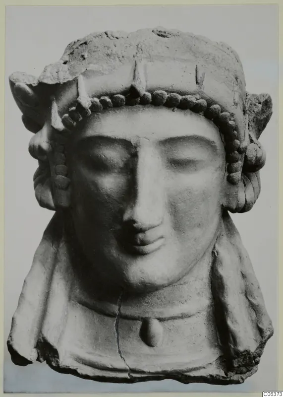 Terracotta bust of a woman with closed eyes, a beaded headband and a pendant on the chest