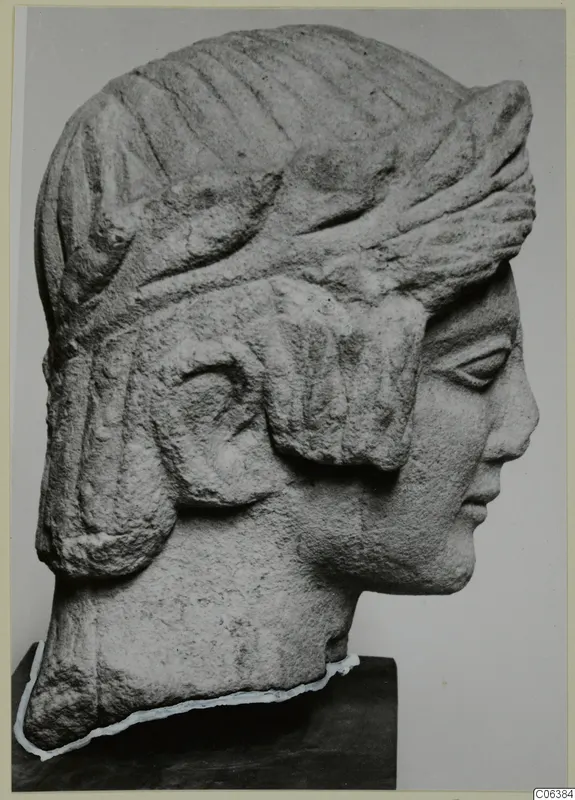 Limestone bust of a figure in right profile, with a grooved headdress, from Mersinaki.
