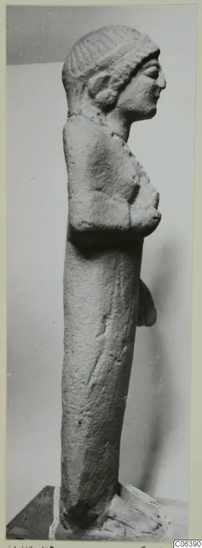 Limestone sculpture of a standing female figure in profile, from Vouni