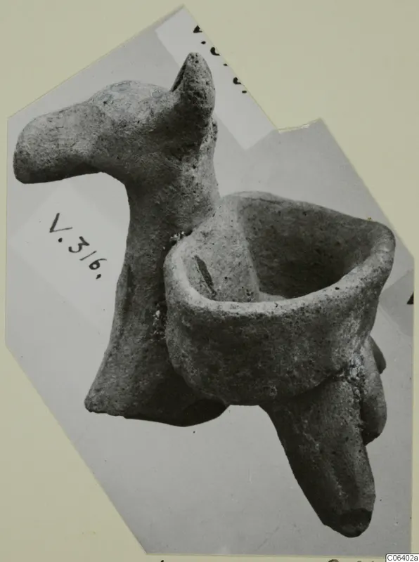 Terracotta animal figurine with an open bowl-shaped trough attached to its back