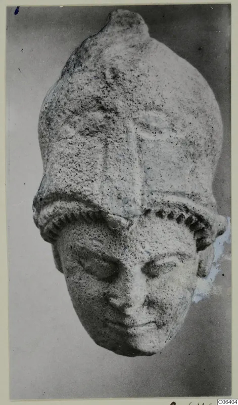 Limestone head with a tall headdress, from Vouni