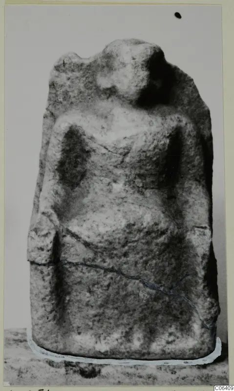 Limestone figure from Vouni, front view, with a rounded head and arms shown close to the sides