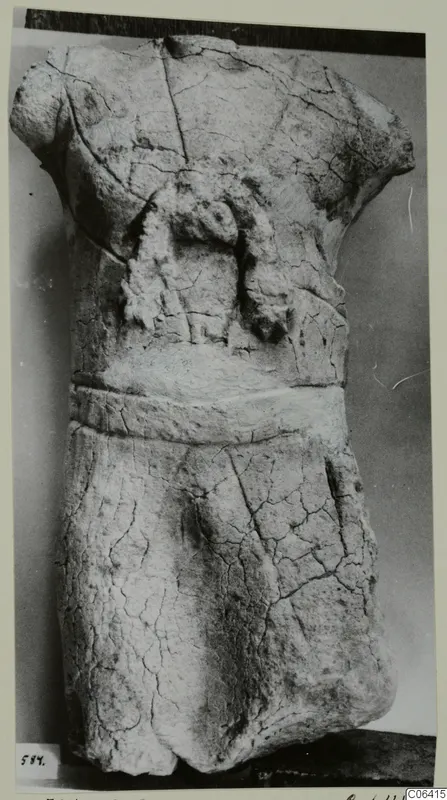 Limestone statue fragment from Vouni: a headless, armless torso with a band around the waist