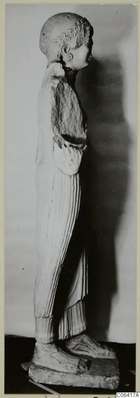 Limestone statue of a standing figure seen in side view, from Vouni